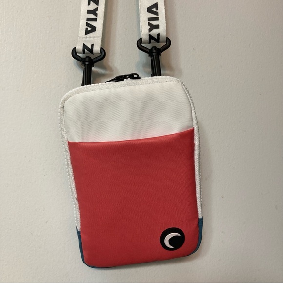 ZYIA Handbags - NWOT Zyia Peach and Teal Phone Crossbody Bag